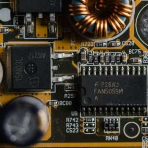 Detailed view of microchips and components on a motherboard circuit board.