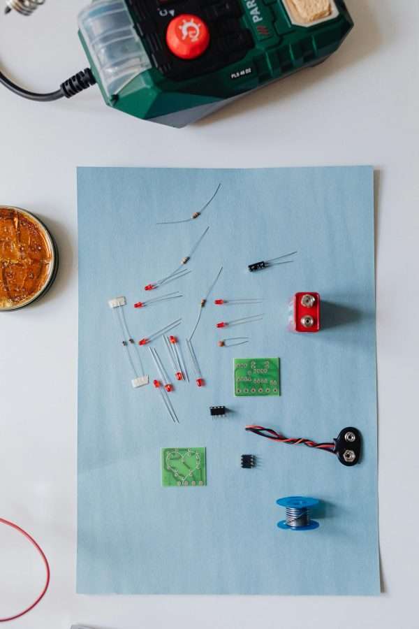 A top view of electronic components arranged for a soldering project, ideal for DIY tech enthusiasts.